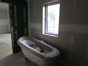 A reconfigured room with a pretty new tub
